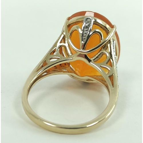 170G - Fire opal ring, 19mm x 15mm, with diamond set shoulders, in 9ct gold, size 'N'.