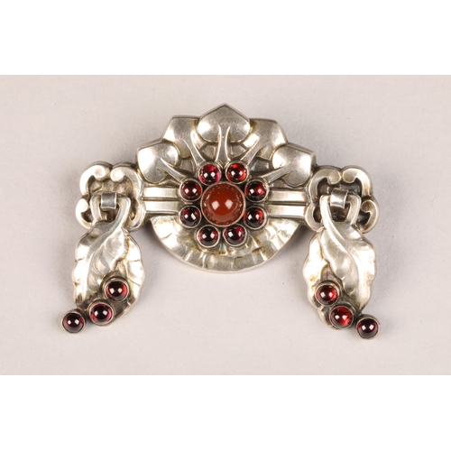 109 - Georg Jensen silver brooch number 9, set with garnet and carnelian decorated with stylised embossed ... 