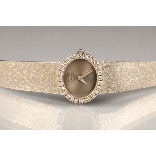 130 - Ladies Baume and Mercier 18 carat white gold wrist watch, with oval dial, diamond encrusted dial, wi... 