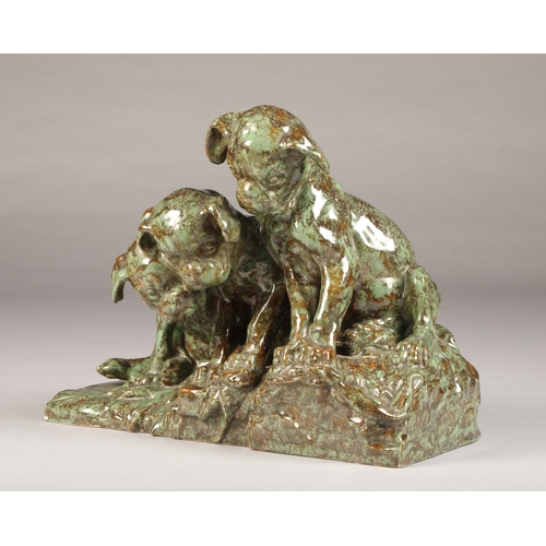 23 - George Lucas Vacossin (French 1870-1942) French pottery figurine group of three bulldog puppies look... 