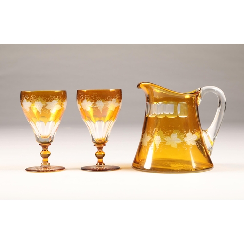 30 - Set of six Bohemian amber flashed glasses and matching amber jug, engraved with vines and grapes, gl... 