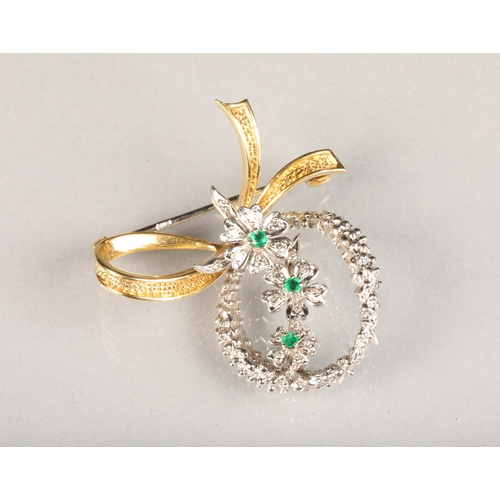 38 - Ladies 18 carat white and yellow gold floral spraydiamond & emerald brooch, set with 19 small diamo... 