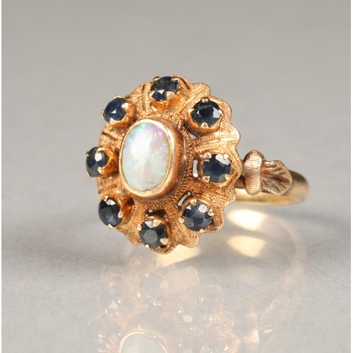 42 - Ladies 14 carat gold opal and sapphire ring, central opal surrounded by eight small sapphires ring s... 