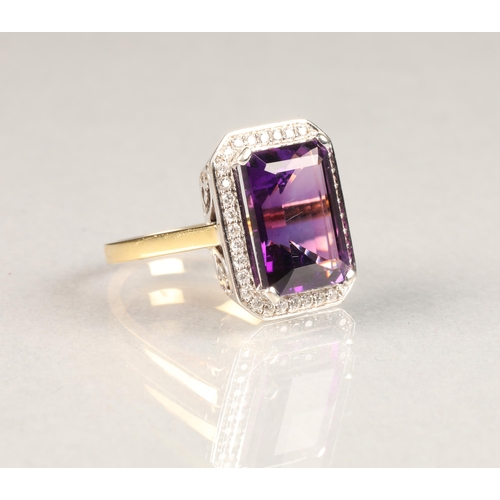 51 - 18 carat gold amethyst and diamond ring, large emerald cut amethyst surrounded by diamonds.ring size... 