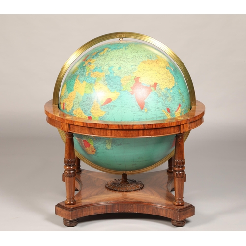 556 - Georama limited terrestrial globe scale 1:17,000,000 mounted on a rosewood stand raised on bun feet ... 