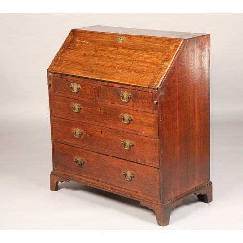 564 - 19th century oak writing bureau, fall front revealing fitted interior over two short drawers over th... 