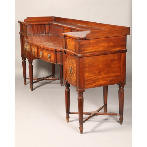 575 - Large regency mahogany bow fronted sideboard, the double tier top with tambour sliding doors over th... 