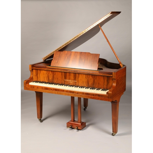 576 - Mahogany cased baby grand piano by B Squire and Son London, raised on square tapered legs, length 12... 