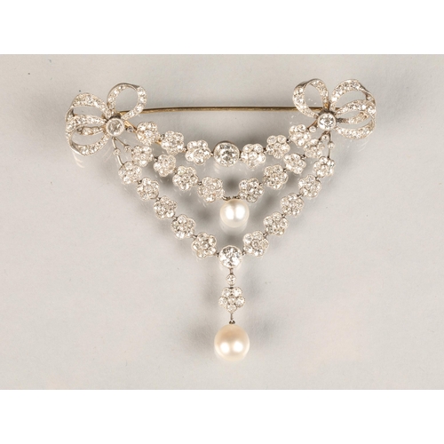 58 - Diamond bar brooch, diamond set bows to either end with three suspended rows of diamond florets. Top... 