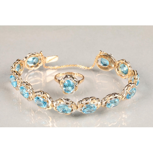 67 - Ladies Blue Topaz bracelet, set with twelve stones on unmarked two tone metal tested as 18 carat gol... 