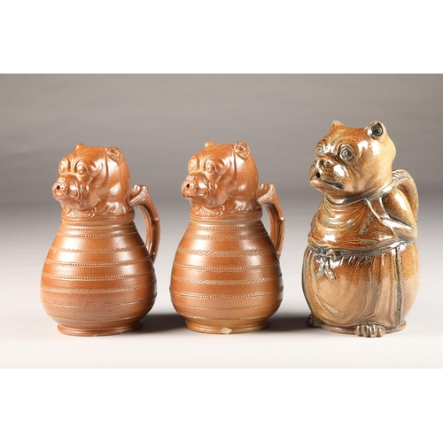 7 - Pair of glazed French bulldog pottery jugs, marked Depose circa 1890's, height 22cm and another simi... 
