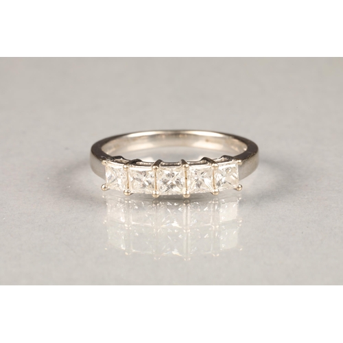 74 - 18 carat white gold  diamond ring, set with five  princess cut diamonds.
ring size O/P, weight 3.6g,