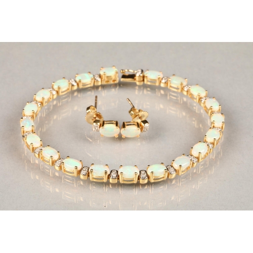 99 - Ladies 18 carat yellow gold opal and diamond bracelet, each opal interspersed with two small diamond... 