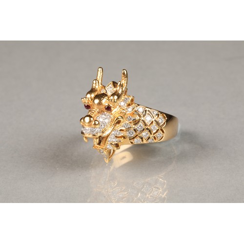 41 - Gents diamond set 18 carat gold ring, in the form of a Chinese dragon with ruby eyes, ring size U/V,... 