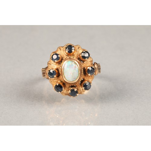 42 - Ladies 14 carat gold opal and sapphire ring, central opal surrounded by eight small sapphires ring s... 