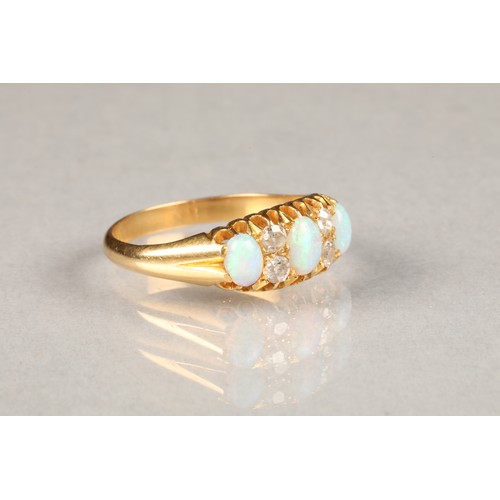 78 - Ladies opal and diamond ring, set with three opals, each opal interspersed with two diamonds, set on... 