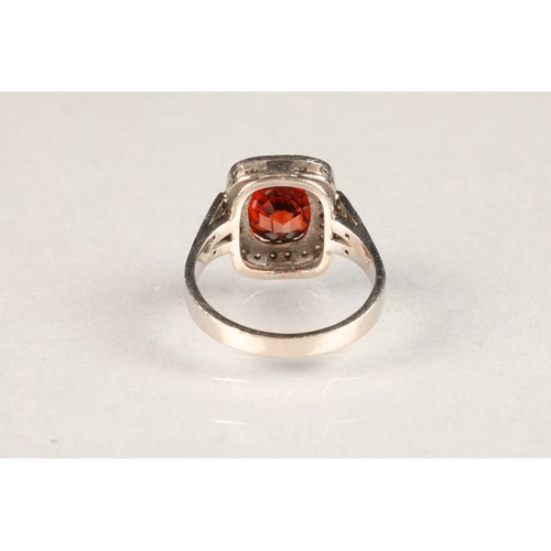 85 - 18 carat white gold diamond and spessartite garnet ring, approximately 4 carat cushion cut spessarti... 