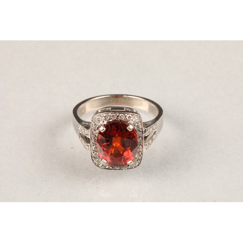 85 - 18 carat white gold diamond and spessartite garnet ring, approximately 4 carat cushion cut spessarti... 