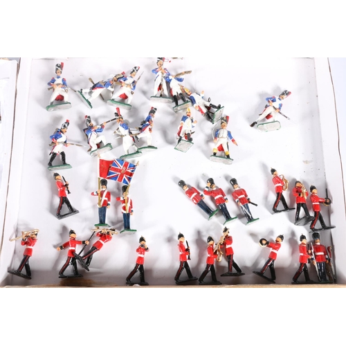 97 - Two trays of hand painted cast-metal model soldiers, 54mm.