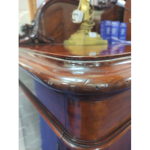 607 - Victorian mahogany reverse breakfront sideboard, foliate scroll raised back above frieze drawers and... 