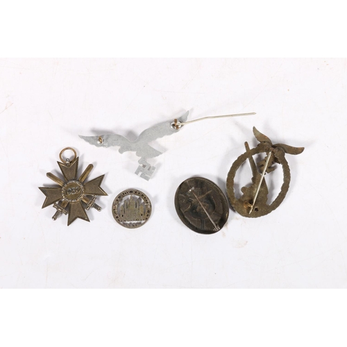 571 - German WWII items including an anti-aircraft Flak badge, a Wound Badge, an aluminium eagle and swast... 