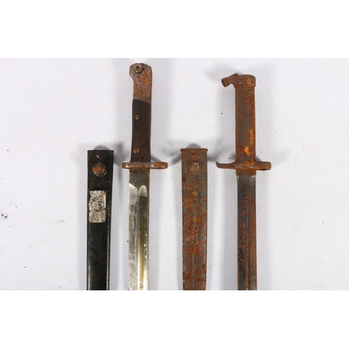 585 - German S84/98 sword bayonet with scabbard and a Swedish 1896 pattern bayonet with scabbard. (2)