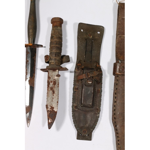 588 - Commando type dagger and two American style fighting knives. (3)