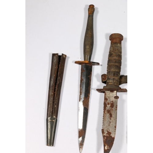 588 - Commando type dagger and two American style fighting knives. (3)