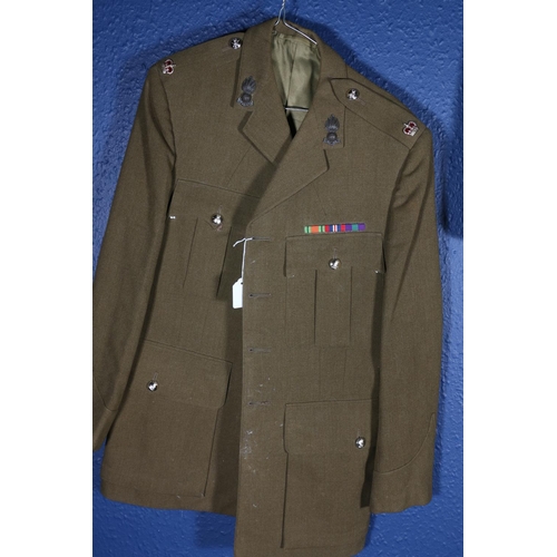 595 - British Army uniform, a WWII era khaki green woollen trench coat with interior pocket label Bernard ... 