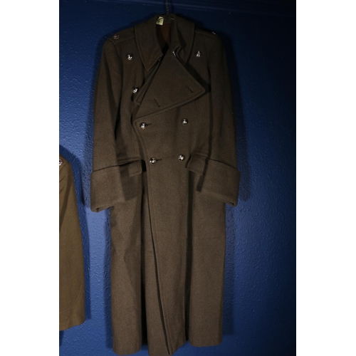 595 - British Army uniform, a WWII era khaki green woollen trench coat with interior pocket label Bernard ... 