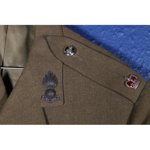 595 - British Army uniform, a WWII era khaki green woollen trench coat with interior pocket label Bernard ... 