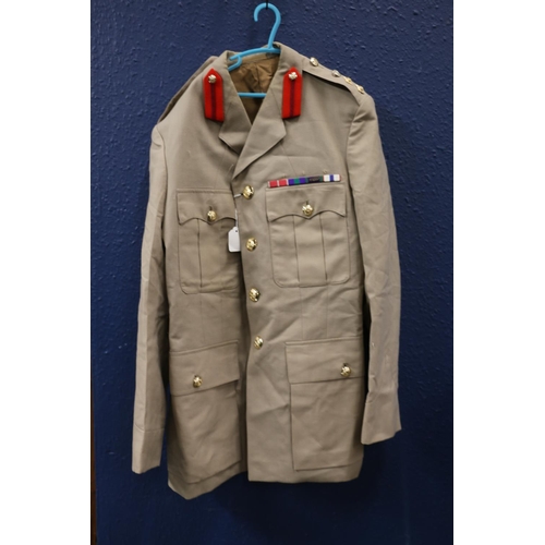 602 - British Army uniform, a khaki green trench coat with Moss Bros of London label having HLI Highland L... 