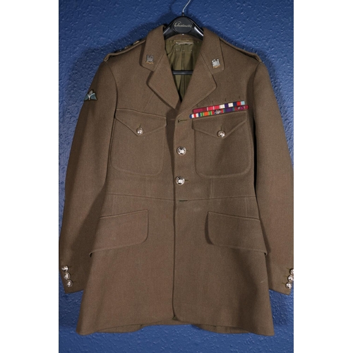 605 - British Army uniform, a British Army khaki green jacket with Jones Chalk and Dawson Ltd of London la... 