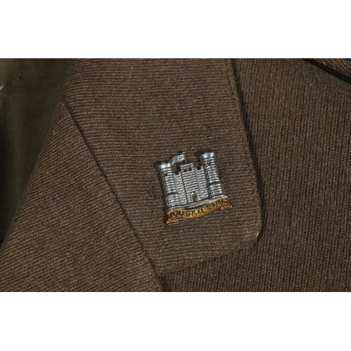 605 - British Army uniform, a British Army khaki green jacket with Jones Chalk and Dawson Ltd of London la... 