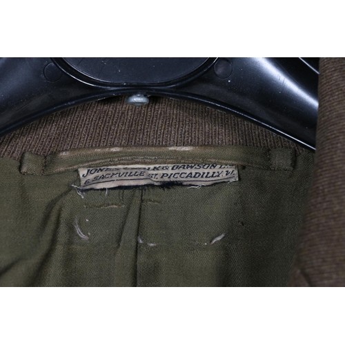 605 - British Army uniform, a British Army khaki green jacket with Jones Chalk and Dawson Ltd of London la... 