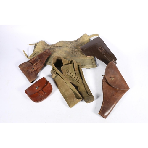 562 - Brown leather Walther PPK holster, two other pistol holsters, a British military issue khaki canvas ... 