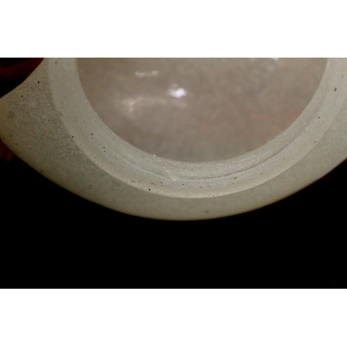 286 - Chinese glass bowl of squat circular form, the snowflake ground with twin carved dark red overlay ha... 