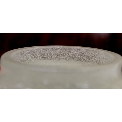 286 - Chinese glass bowl of squat circular form, the snowflake ground with twin carved dark red overlay ha... 