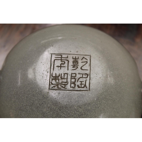 286 - Chinese glass bowl of squat circular form, the snowflake ground with twin carved dark red overlay ha... 