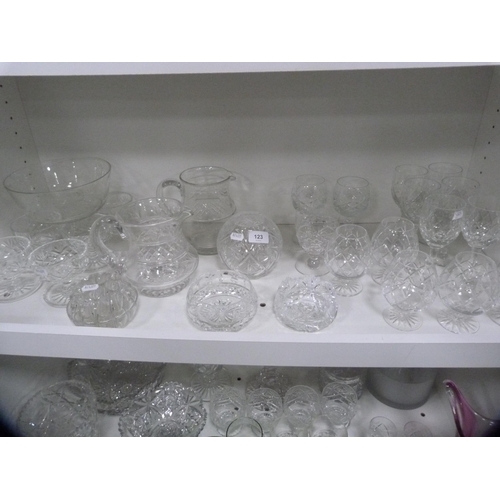123 - Collection of cut and other glassware including jugs, brandy balloons, sundae dishes etc (one shelf)... 