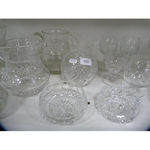 123 - Collection of cut and other glassware including jugs, brandy balloons, sundae dishes etc (one shelf)... 