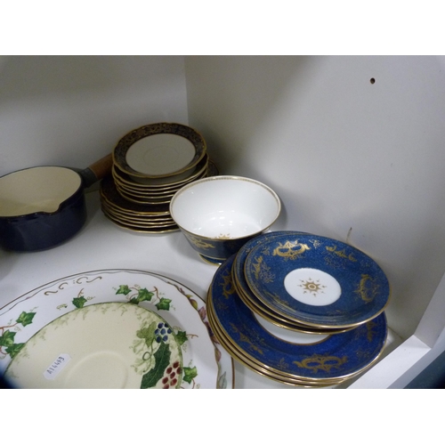 127 - Staffordshire Churchill part service, other decorative plates and a large glass bowl etc (two shelve... 