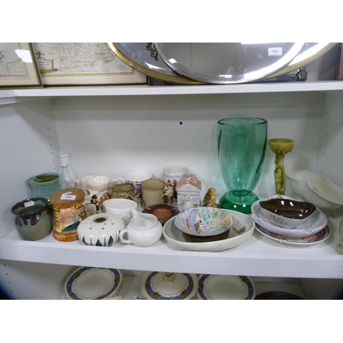 128 - Collection of decorative items including a large glass vase, art pottery jugs, tankards, commemorati... 