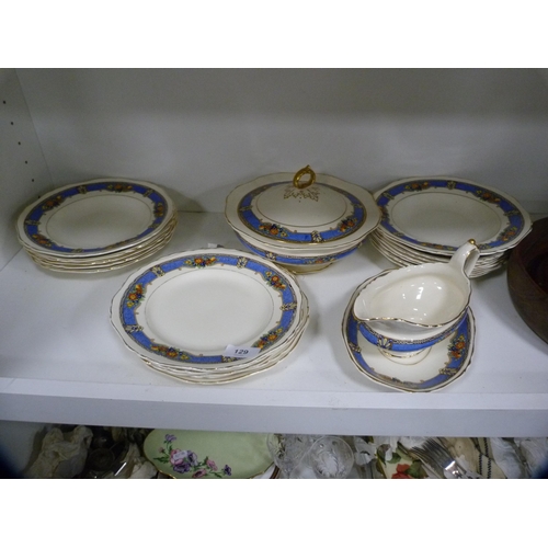 129 - Carlton Ware dish, part dinner service, salad bowl and a barometer (one shelf).