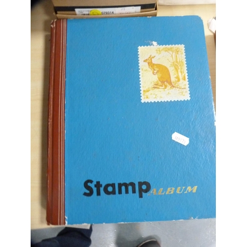 152 - Three albums including stamps.