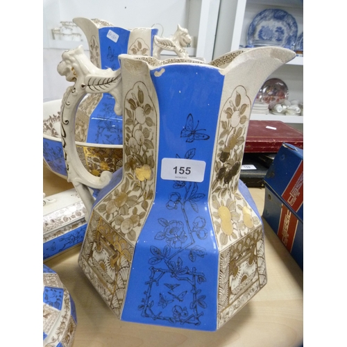 155 - Blue and gilt five-piece wash set.