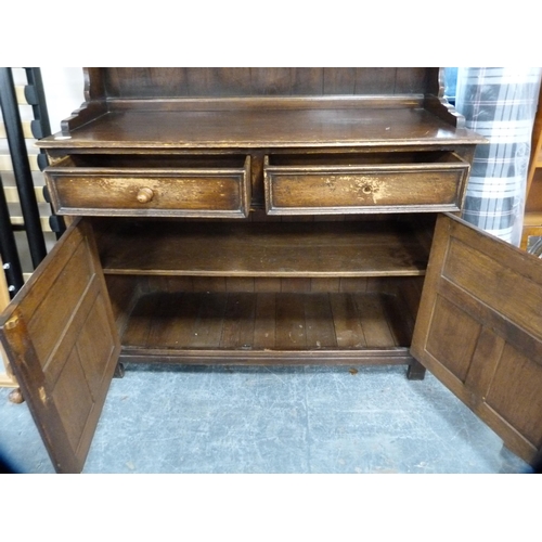 410 - Oak dresser fitted with two drawers and panel door cupboards.