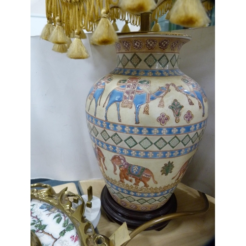 172A - Oriental table lamp and a gilt metal framed mirror.