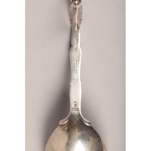 183 - Boxed set of three Georg Jensen Silver serving spoons, with scrolled handles with leaf finials, hamm... 