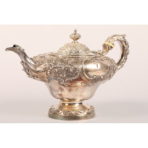 216 - Victorian three piece silver tea service comprising of a teapot, sugar bowl and cream jug, with embo... 